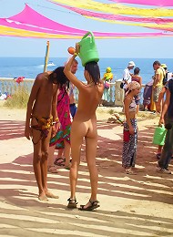 Teen nudists get naked and heat up a public beach